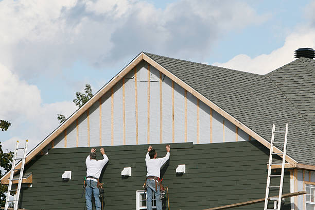 Professional Siding technician working in Micro, NC